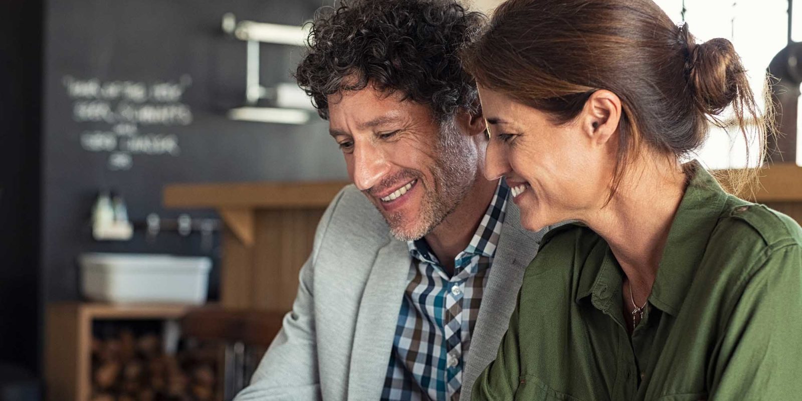 A couple at a cafe considers their debt relief options